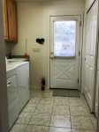 Laundry and Pantry Room with Exit Door